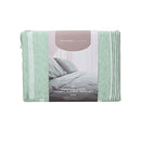 Front packaging details of the green and white striped sheet set, showcasing uniform horizontal stripes for a minimalist or nautical-themed bedroom decor.
