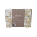 Back packaging details of a natural-toned bed sheets and pillows, adorned with a monochromatic white floral and foliage pattern, craft a serene and unique design.