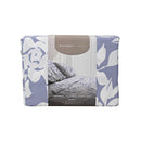 Front packaging details of a lavender-toned bed sheets and pillows, adorned with a monochromatic white floral and foliage pattern, craft a serene and unique design.