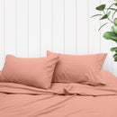 A clean and classic orange bed with matching sheets and pillows, made of 100% microfibre for a soft and warm feel.