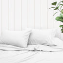 A clean and classic white bed with matching sheets and pillows, made of 100% microfibre for a soft and warm feel.