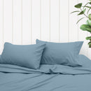 A clean and classic blue bed with matching sheets and pillows, made of 100% microfibre for a soft and warm feel.