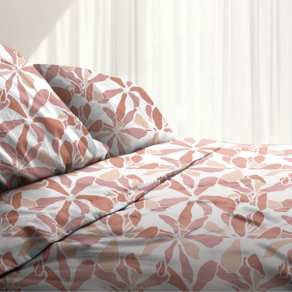 A bed sheet set with a floral pattern on it - a charming and elegant addition to your bedroom, creating a warm and welcoming atmosphere.