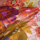 Close-up of the Livia Multi print showing large painted flowers in warm tones