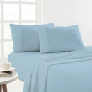 Light blue Egyptian cotton flannelette sheets styled in a bright, cosy bedroom setting