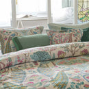 alt="Premium cotton quilt cover with ornate mirrored design and reversible foliage pattern in a cosy bedroom paired with pillowcases"