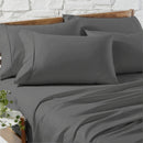 Close-up of silky, smooth charcoal Egyptian cotton sheets with elegant detail