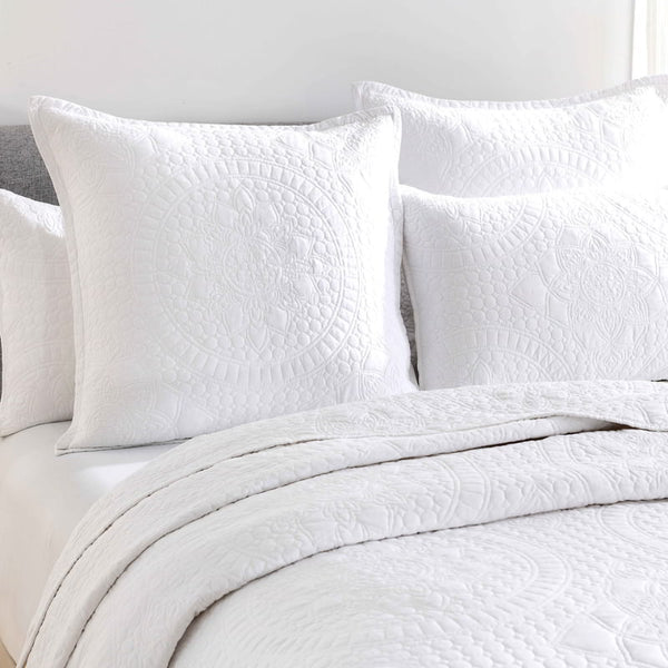 alt="A white european pillowcase features an inspiration from the ornate detailing of traditional Greek tile patterns.