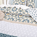 Layered bed view with reversible quilt cover and textured throw blanket