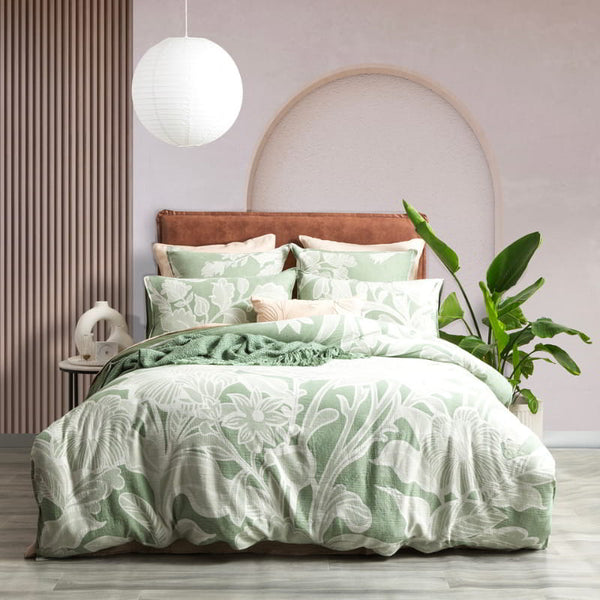 Luxurious quilt cover set featuring floral sage green designs with large leaves in a unique waffle pattern.