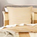 European pillowcase in Berlin Checks pattern adds warmth and texture to made bed