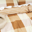 Close-up of the reversible side with soft tan and white stripes

