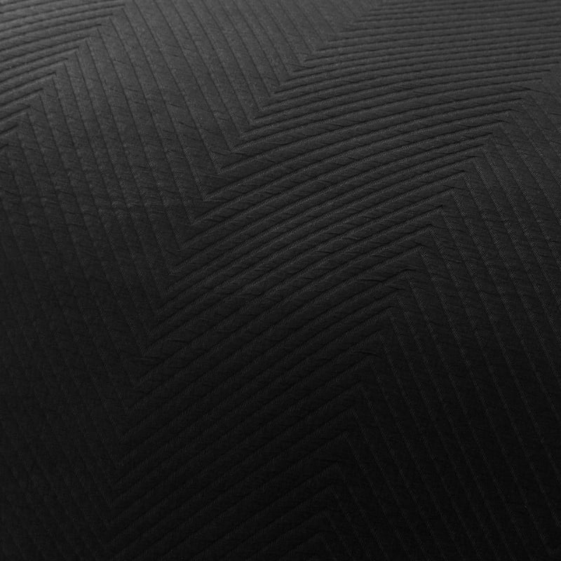 alt="Zoom in details of a quilt cover featuring an embossed design with a sham edge deep black"