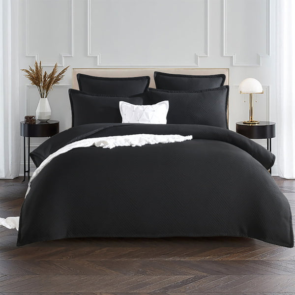alt="Showcasing a quilt cover featuring an embossed design with a sham edge deep black"