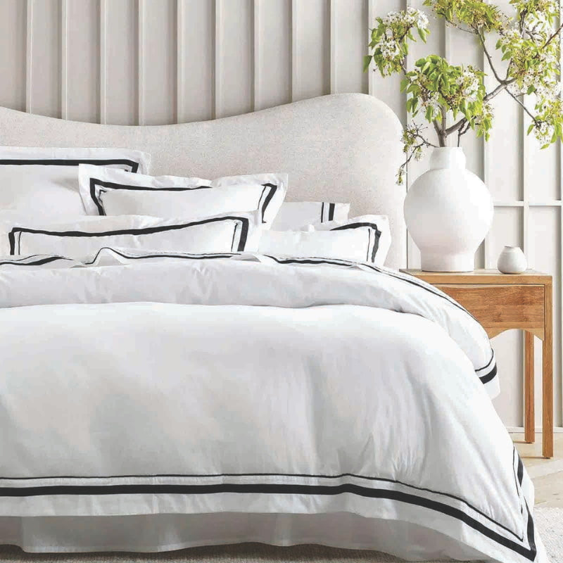 Side view of the luxurious Renee Taylor Cloud Quilt Cover Set in white and charcoal, crafted from 1000-thread count Egyptian cotton for ultimate comfort.