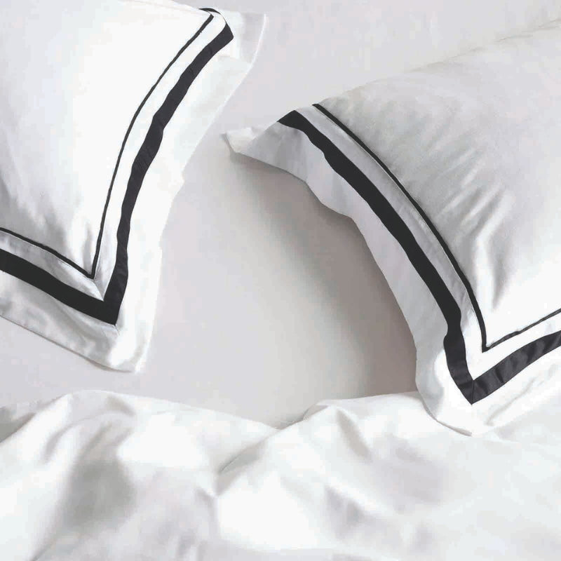 Closer look of the luxurious Renee Taylor Cloud Quilt Cover Set in white and charcoal, crafted from 1000-thread count Egyptian cotton for ultimate comfort.