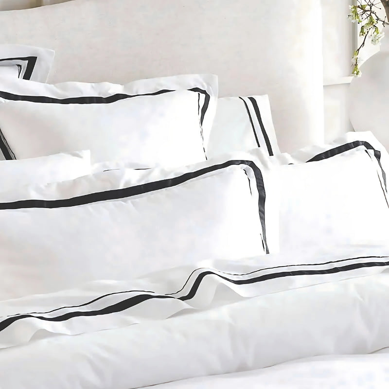 Closer look of the luxurious Renee Taylor Cloud Quilt Cover Set in white and charcoal, crafted from 1000-thread count Egyptian cotton for ultimate comfort.