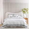Luxurious Renee Taylor Cloud Quilt Cover Set in white and charcoal, crafted from 1000-thread count Egyptian cotton for ultimate comfort.