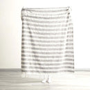 Full view of Renee Taylor Como Onyx throw held up to show size and pattern

