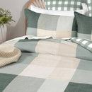 Soft cotton pillowcase layered with matching quilt cover in coastal bedroom