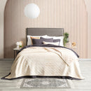 A cozy bedroom featuring stone colour ultra soft velvet blanket with a diamond pattern and clean edge.
