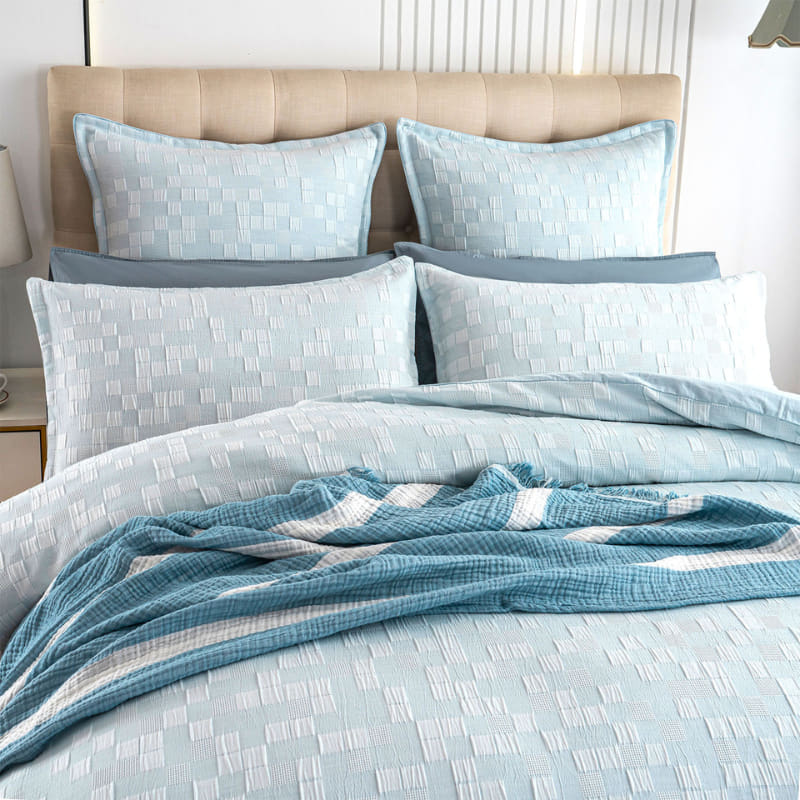 alt="French blue quilt cover set designed with delicate quilting texture and is pleasant to the touch with the pillowcases, instantly bringing life to any bedroom."