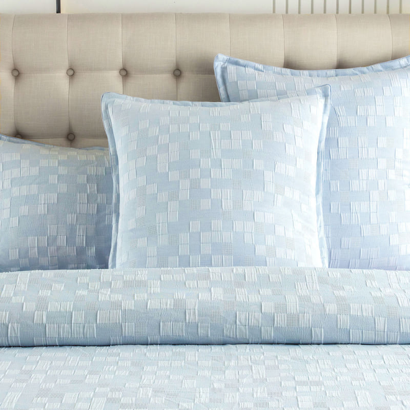 alt="Close up details of a French blue quilt cover set designed with delicate quilting texture and is pleasant to the touch with the pillowcases, instantly bringing life to any bedroom."