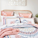 Coordinated bed styling with matching European pillowcases and relaxed decor