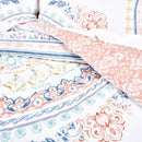 Reversible side of the Kalina quilt cover showing tile-inspired pink and white pattern