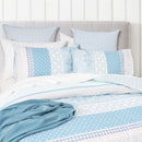 Detailed shot of quilt cover pattern showing stripes, florals, and geometric accents