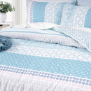 Renee Taylor Margot Cotton Blue Quilt Cover styled with layered blue and white pillows