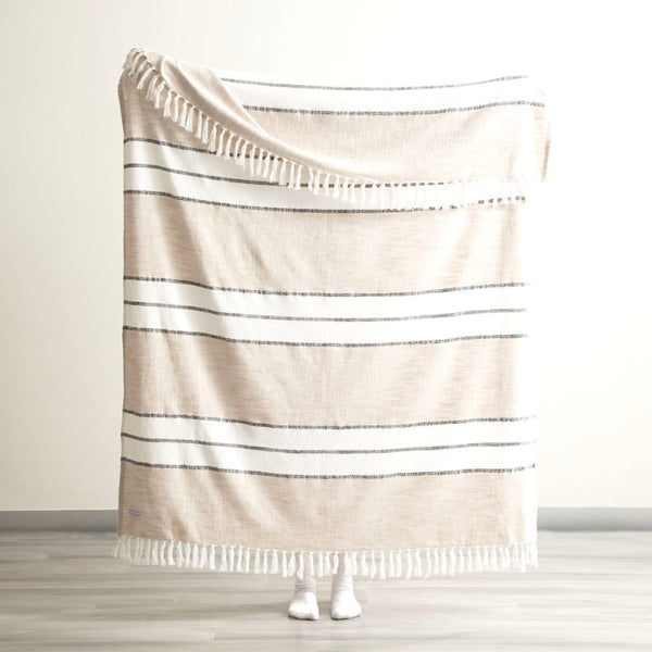 Full view of the Modena Stripe Midnight Throw displayed against a light wall