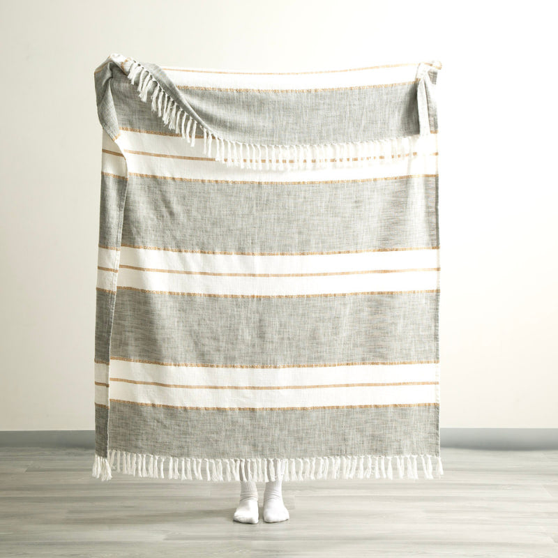 Full size of the Modena Stripe Sage Throw held up to show generous dimensions and relaxed drape