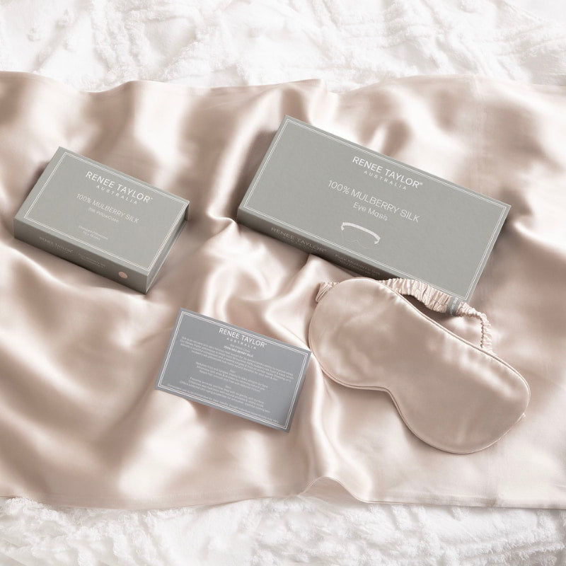 alt="A luxurious sand satin eye mask with packaging box made from 100% pure mulberry silk. Wake up feeling refreshed and rejuvenated with this gentle and hydrating mask."