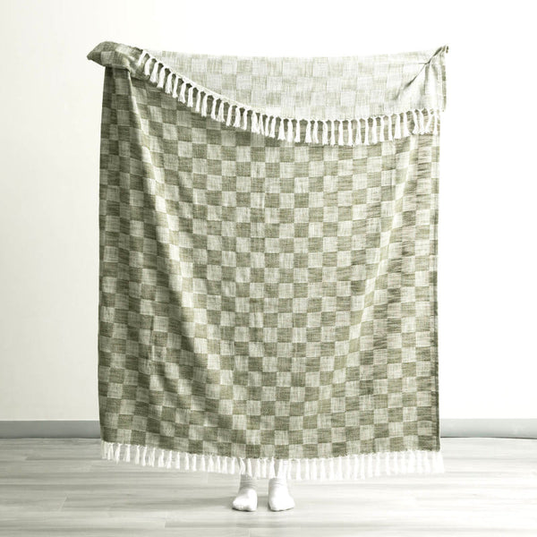 Full size Renee Taylor Jade Throw held up to show generous dimensions and texture