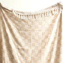Close-up of Renee Taylor Nevis Nude Throw showing stone-washed texture and soft two-tone checkered weave.
