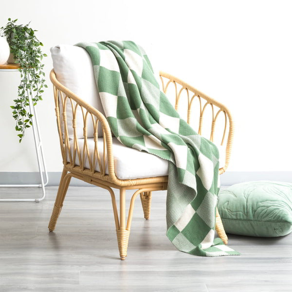 alt="A shade of green with a 100% Yarn dye cotton knitted throw with captivating large checks design. Perfect for modern, classic, traditional, or contemporary decor."