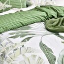 Reversible quilt cover with green zigzag pattern peeking through layers