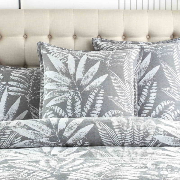 alt="Luxurious, eclectic mix of modern and conventional design european pillowcase that creates a tropical retreat with lush leaves."