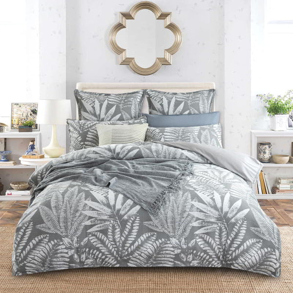 alt="A luxurious, eclectic mix of modern and conventional design quilt cover set that creates a tropical retreat with lush leaves."