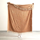 Full view of the tobacco throw held up to show size and woven texture.

