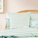 Coordinated European pillows and quilt cover styled in a fresh, relaxed setting