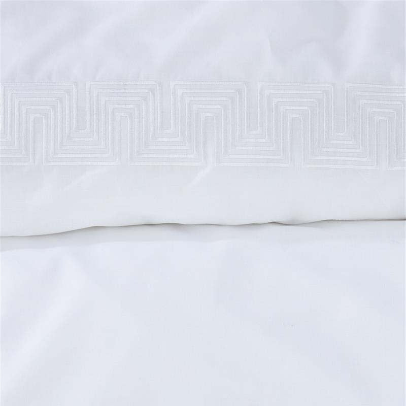 alt="Close-up look of a sophisticated white quilt cover set featuring a narrow horizontal band with embroidered geometric pattern"