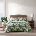 A luxurious tropical print quilt cover set with palm leaves, perfect for a peaceful and comfortable siesta. 