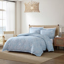 Relaxed bedroom setup featuring the Tommy Bahama blue quilt cover in a light-filled room