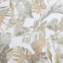 Close up details of a tropical print quilt cover set featuring green and gold tones enhances a cosy bedroom atmosphere for restful sleep.