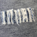 alt="Showing the detailed pattern of a denim distressed european cushion"