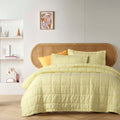 alt="French linen coverlet set with 2 quilted pillowcases for elegant bedding."