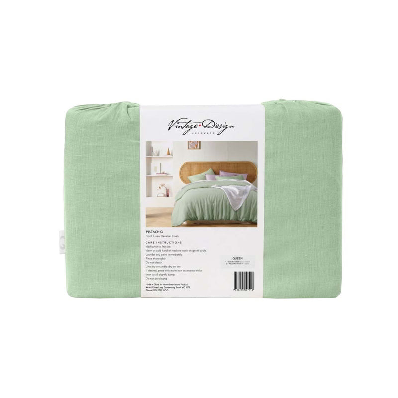 alt="An elegant French linen pistachio quilt cover in its packaging"