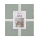 Packaging details of a green cotton-linen tablecloth featuring a unique helm design perfect for enhancing your dining decor.